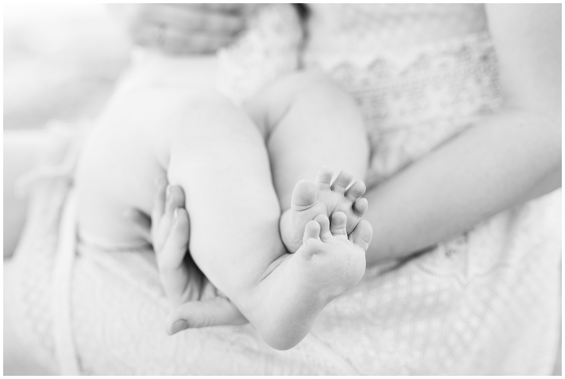 mommy and baby standing on the beach for a mommy and me session with her daughter, close up of feet while breastfeeding