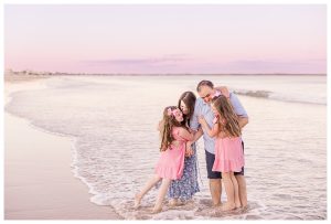beautiful maine portrait session of a family by maine photographer andrea simmons during the sunset at old orchard beach