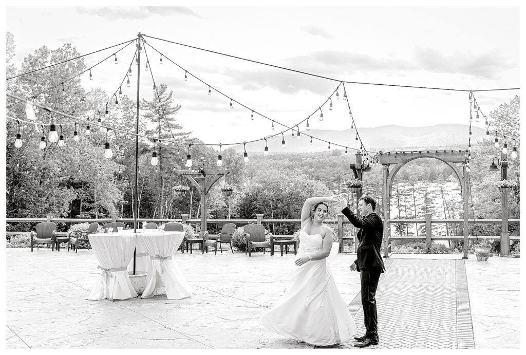 bride and groom get married at wedding venue tarry a while in bridgton maine. upscale luxury wedding with black tie groomsmen tuxes and black satin bridesmaid dresses, colorful flowers, summer maine wedding, lake, tent, outdoor dance floor, destination wedding